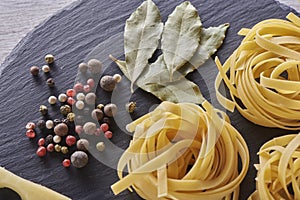 Spiral italian Macaroni Pasta isolated on shale board