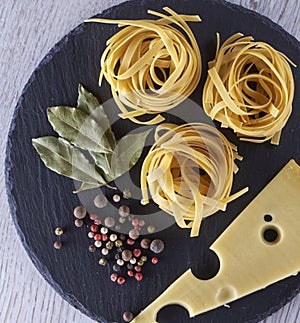 Spiral italian Macaroni Pasta isolated on shale board