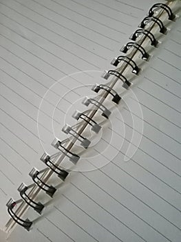 Spiral lined notebook. Isolated in white