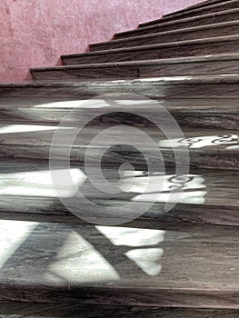 Spiral marble stairs with interesting shadows