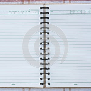 A spiral notebook.