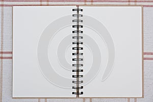 A spiral notebook.