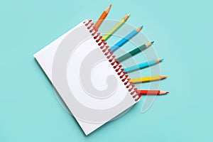 Spiral notebook with colored pencils and with copy space for your image or text