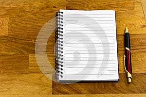 Spiral notebook copy space butcher block wooden background