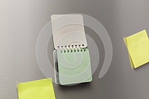 spiral notebook on fridge