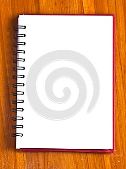 spiral notebook on a wood background