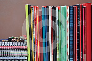 Spiral notebooks stacked on a shelf