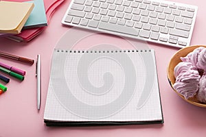 Spiral notepad on pink background