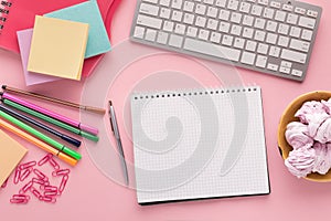 Spiral notepad on pink background, top view