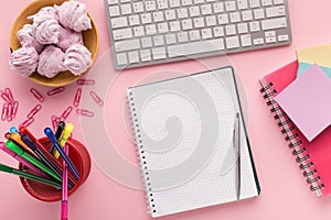 Spiral notepad on pink background, top view