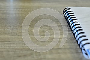 Spiral notepad on a wooden desk