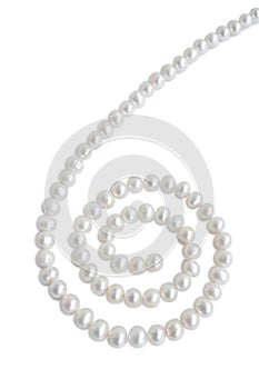 Spiral ornament figure made of pale pearl necklace with shadow