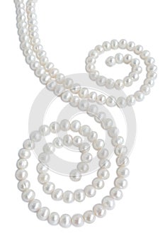 Spiral ornament figure made of pale pearl necklace with shadow
