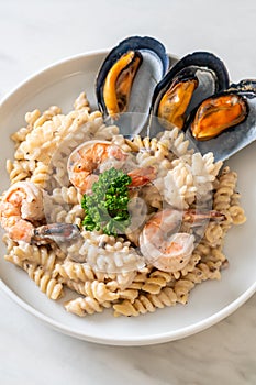 Spiral pasta mushroom cream sauce with seafood