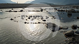 Spiral from pebble to stones, on the shore, beach Gravedona in Lake Como
