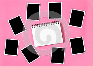 Spiral photo album book picture frames pink background