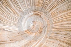 Spiral shape of a stone staircase in Hartenfels Castle, Germany