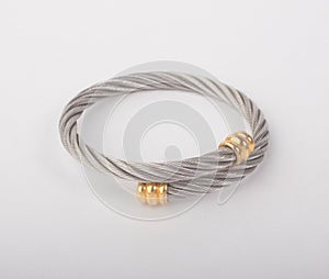 Spiral silver bangle decorated with golden