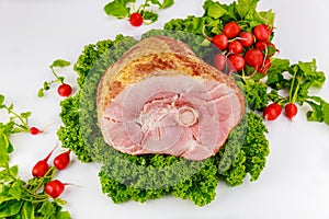 Spiral sliced hickory smoked ham with fresh kale and radish