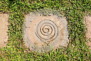 Spiral on Square Stone as a paving with grass