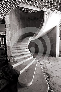 Spiral staircase in an abandoned hotel