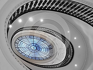 Spiral staircase with glass atrium photo
