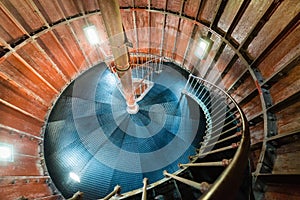 A spiral staircase inside a lighthouse.