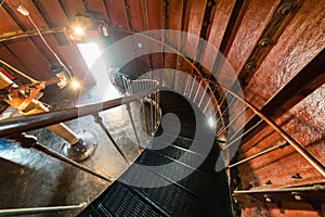 A spiral staircase inside a lighthouse.