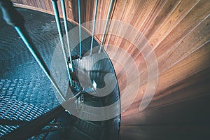 A spiral staircase inside a lighthouse. - vintage film effect