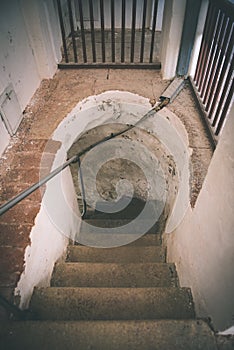 A spiral staircase inside a lighthouse. - vintage film effect