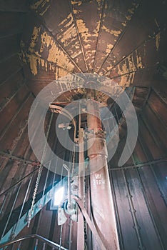 A spiral staircase inside a lighthouse. - vintage film effect