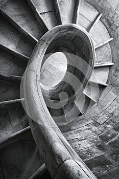 Spiral staircase from a low angle, highlighting the curves and architectural details