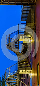 Spiral staircase of a modern building, lighted at night, modern city architecture