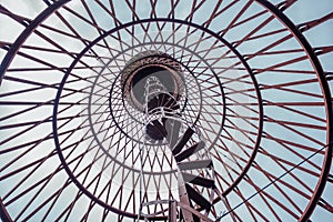 Spiral staircase of rusty abandoned water tower. First hyperboloid of engineer Shukhovl