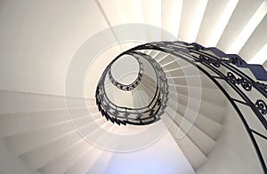 Spiral staircase still life with black ornament railing top view