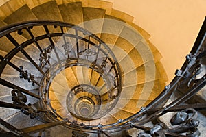 Spiral staircase and stone steps in old tower