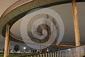 Spiral staircase to Theodor-Heuss-Bridge in DÃ¼sseldorf at night