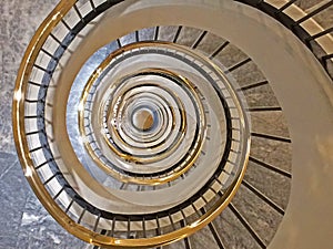 Spiral staircase in a high building photo