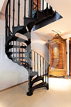 Spiral staircase and a wardrobe
