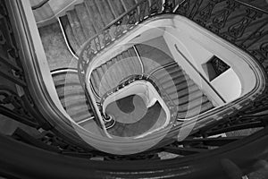 Spiral staircase winding down to ground floor