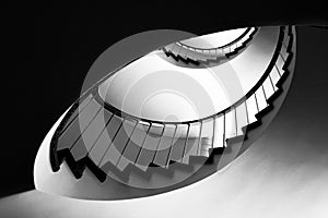 Spiral staircases with grey metal handrails