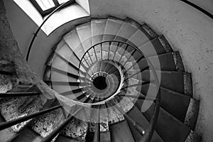 Spiral stairs, black and white. Architecture old Italian palace.
