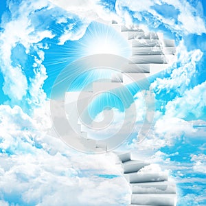 Spiral stairs in sky with clouds and sun