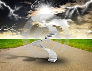 Spiral stairs in sky with green grass, road and