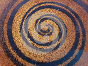 Black spiral on a brown background.,Abstract Circle Speed Pattern Blurred .