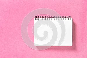 Spirale book pink background Paper notepad photo