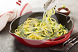 Spiralized zucchini noodles in a cast iron pan