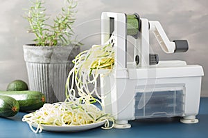 Spiralizing courgette raw vegetable with spiralizer