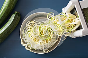 Spiralizing courgette raw vegetable with spiralizer