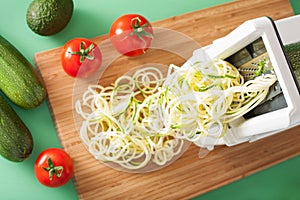 Spiralizing courgette raw vegetable with spiralizer